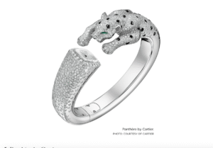 A bracelet in the shape of a cheetah, encrusted in white diamonds.