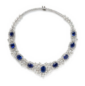 A diamond necklace set with 9 very large blue sapphires