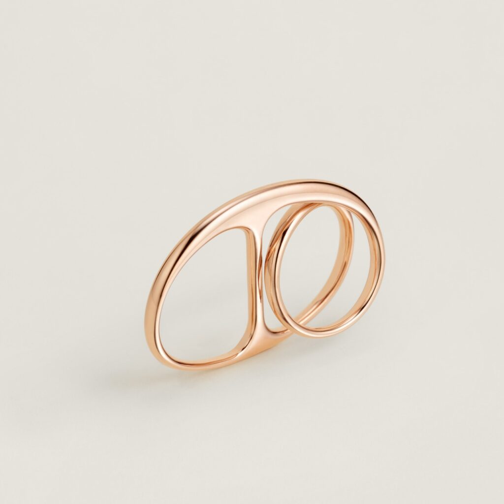 A two finger ring in rose gold