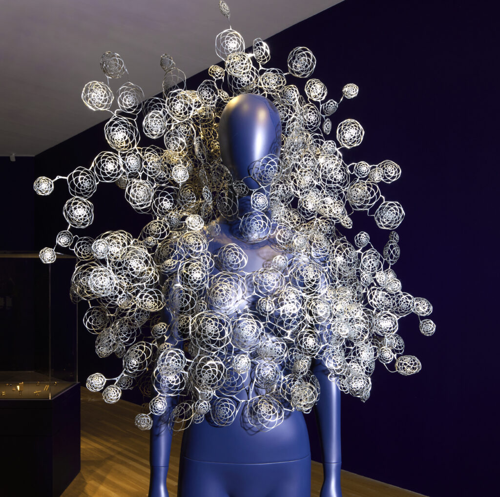 blue mannequin with Iris Helpern necklace