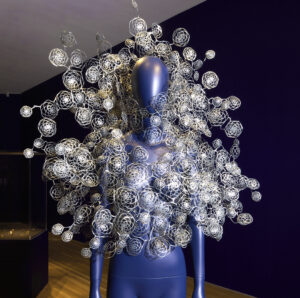 blue mannequin with Iris Helpern necklace